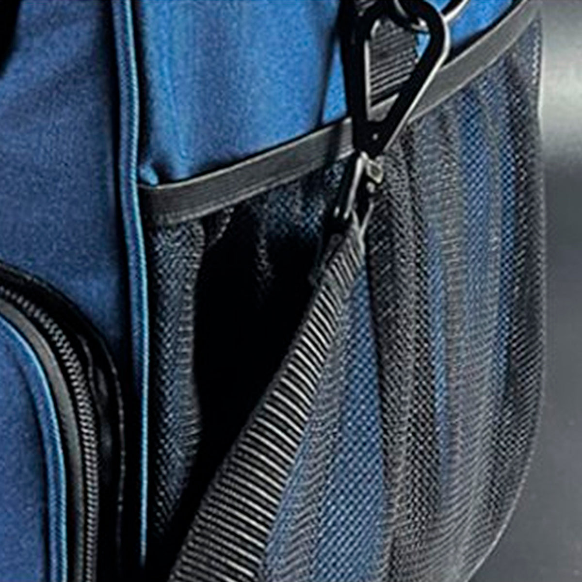 Close-up of a blue and black mesh bag with a black carabiner clip attached near the zipper.